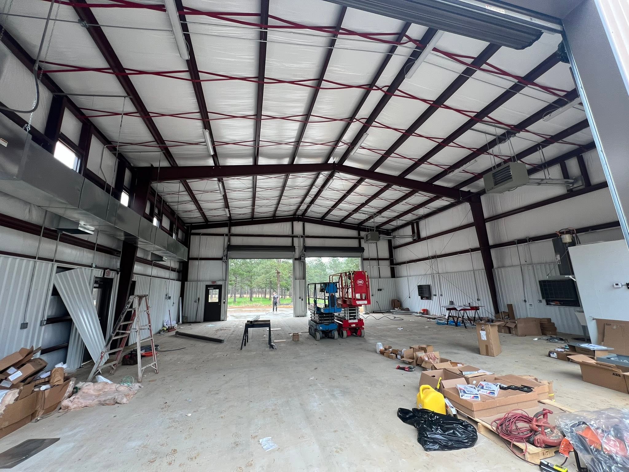 Fire station interior with structural steel and installed ventilation