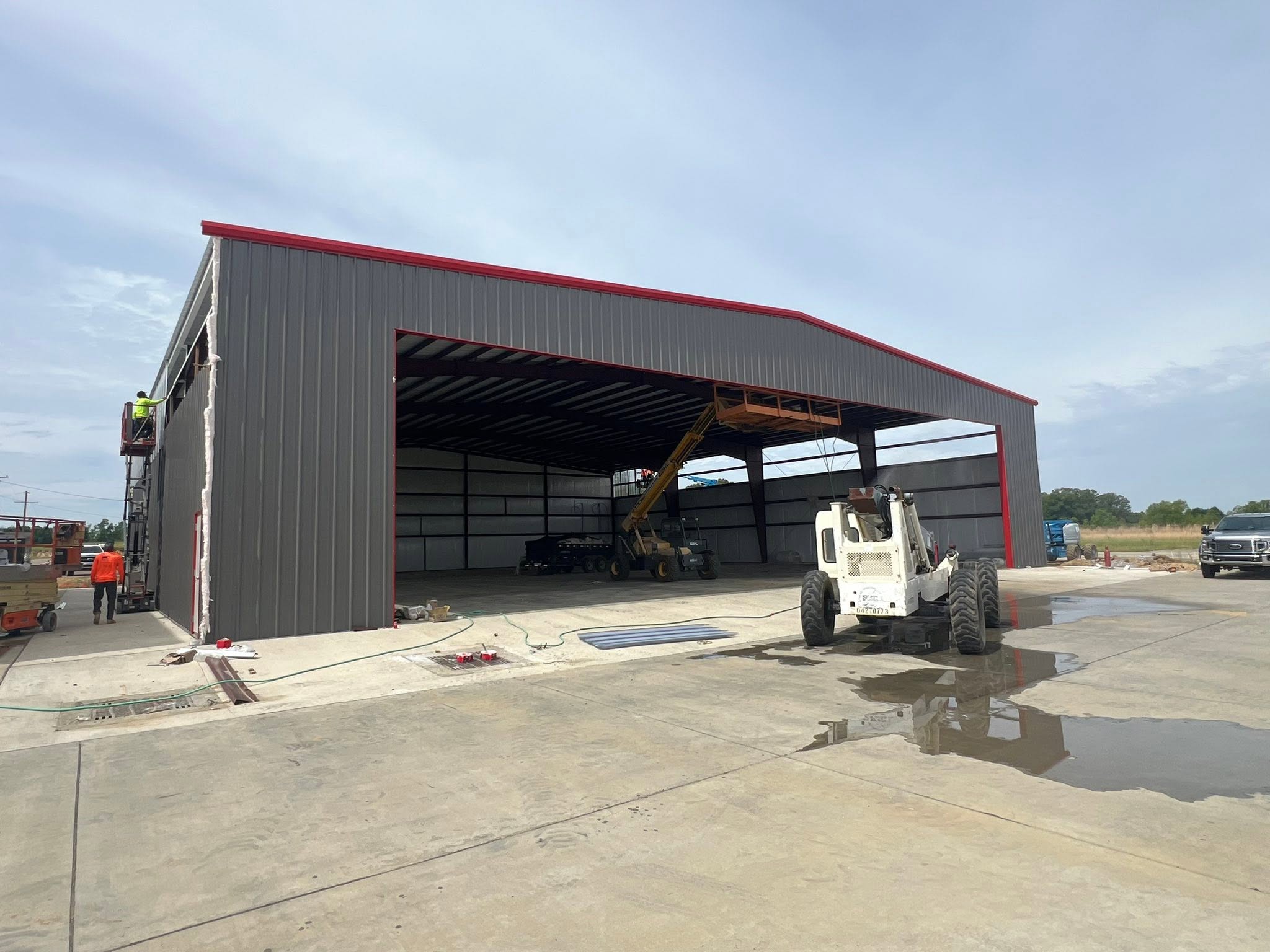 100-foot-wide hangar exterior with large aircraft opening